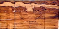 a piece of wood with a maple leaf on it